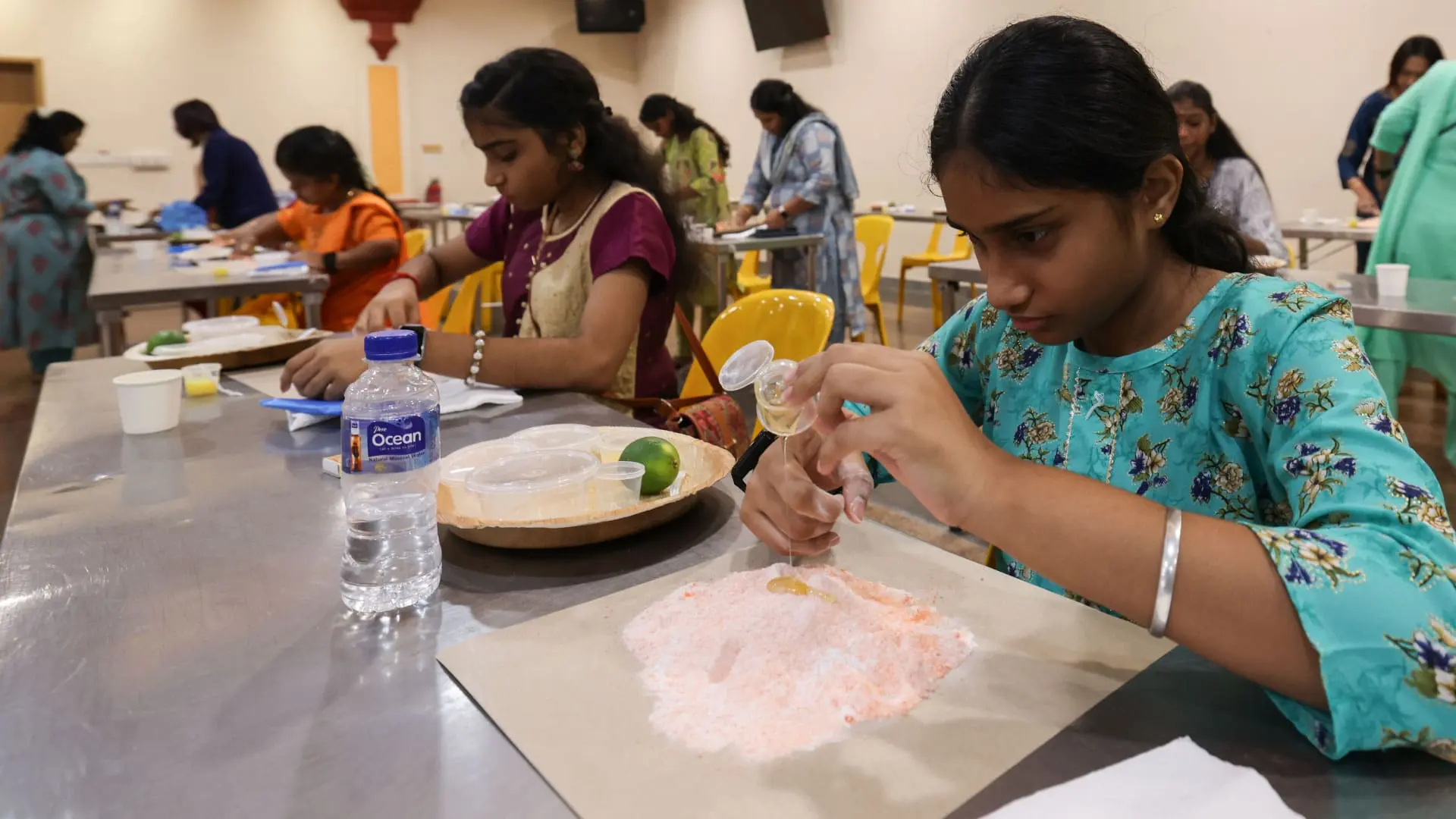 Indian devotees participate in workshop to create flour lamps